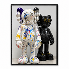 Tableau avec deux personnages Companion, l’un blanc éclaboussé de peinture et l’autre noir brillant.